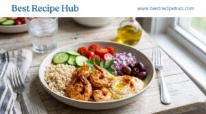 Mediterranean shrimp bowl with vegetables, brown rice, cucumber, tomatoes, and healthy ingredients